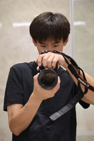 The photographer holding his camera