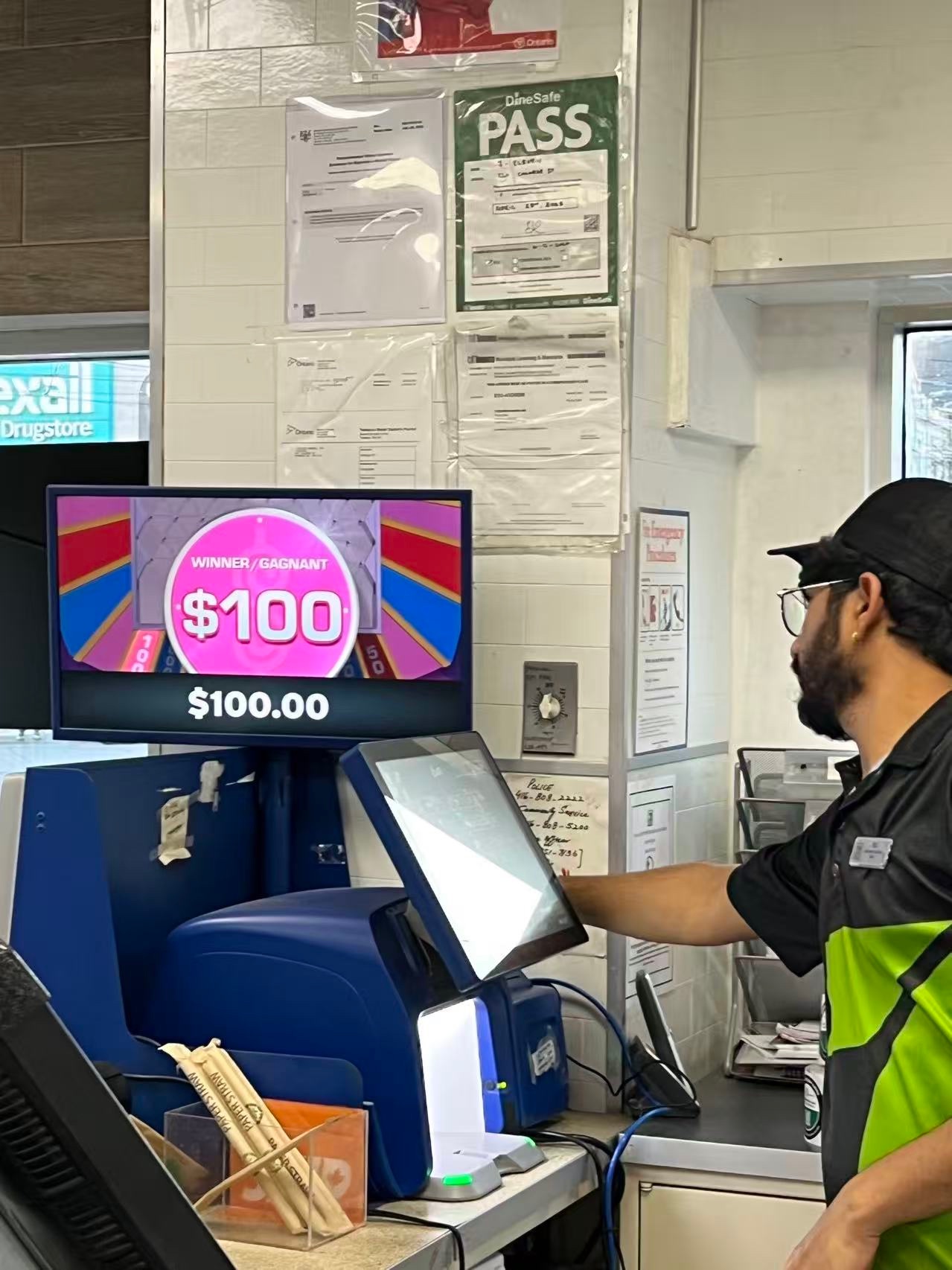 A lottery terminal displaying a $100 win